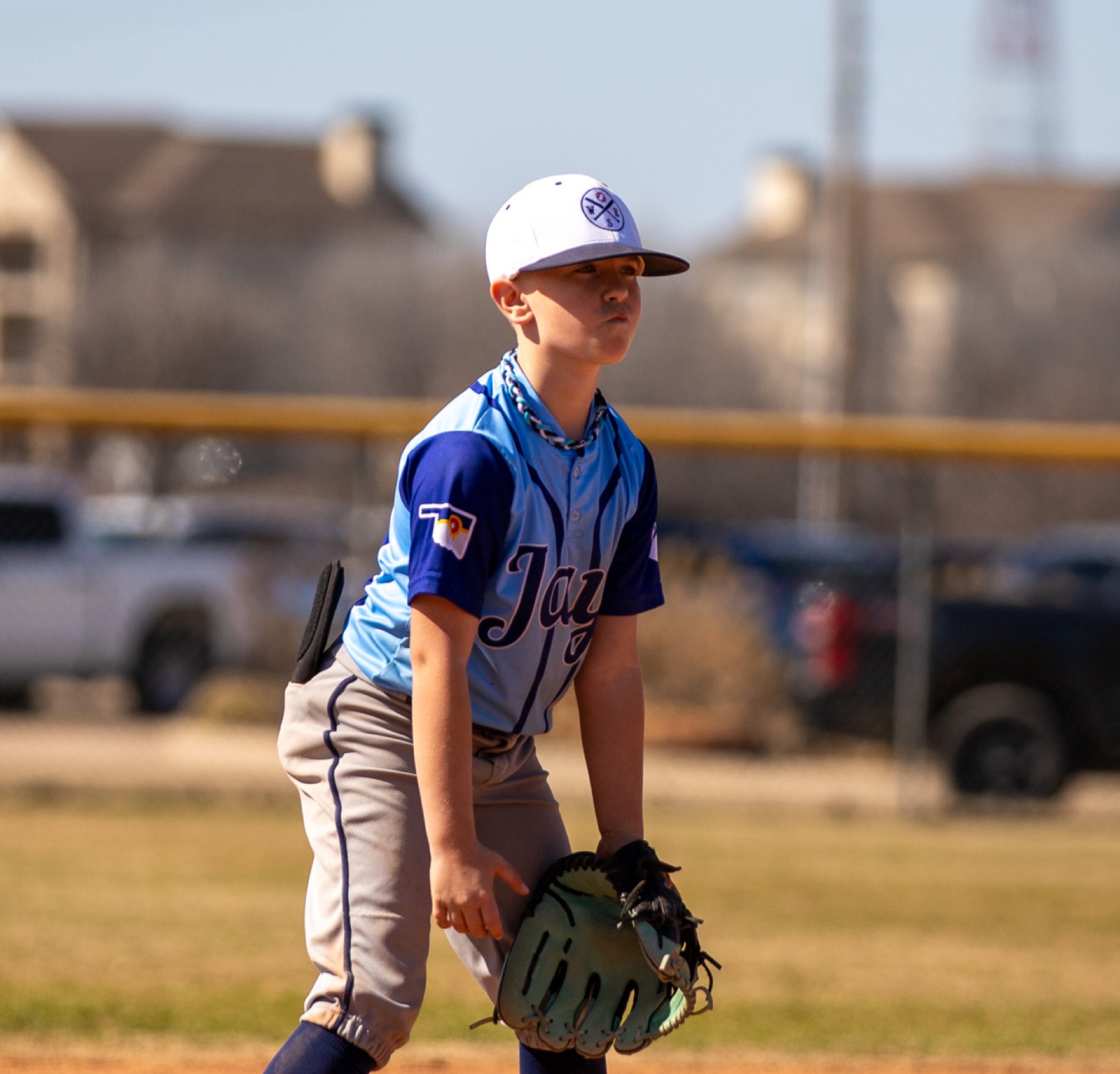 Young baseball player ready in the field
